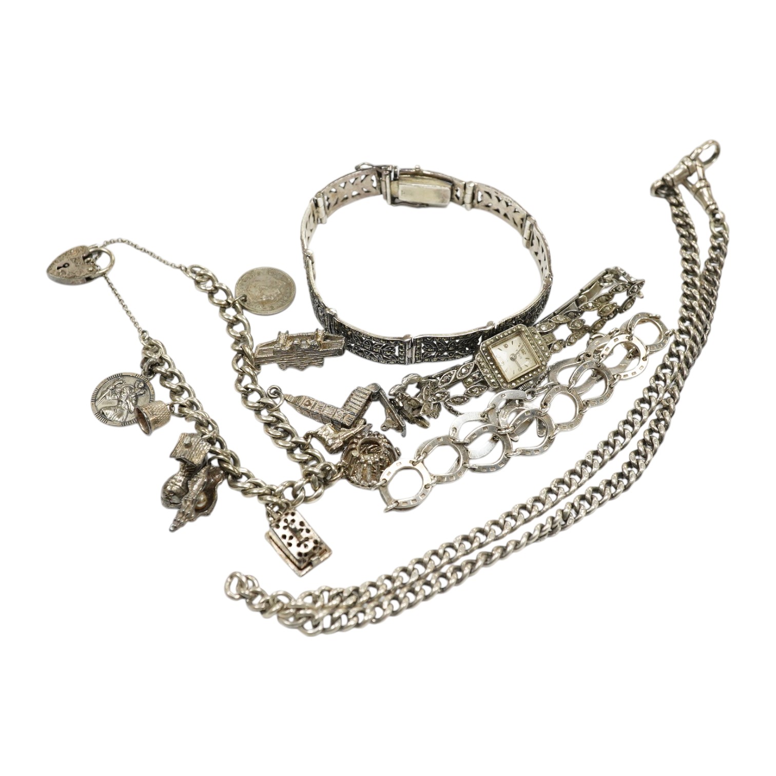 Two silver bracelets, a silver watch chain, a silver and marcasite bracelet and a similar watch. Condition - fair